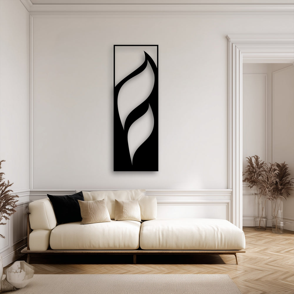 The cream couch and textured rug softly complement the minimalist vertical unique metal wall art with flowing leaf designs.