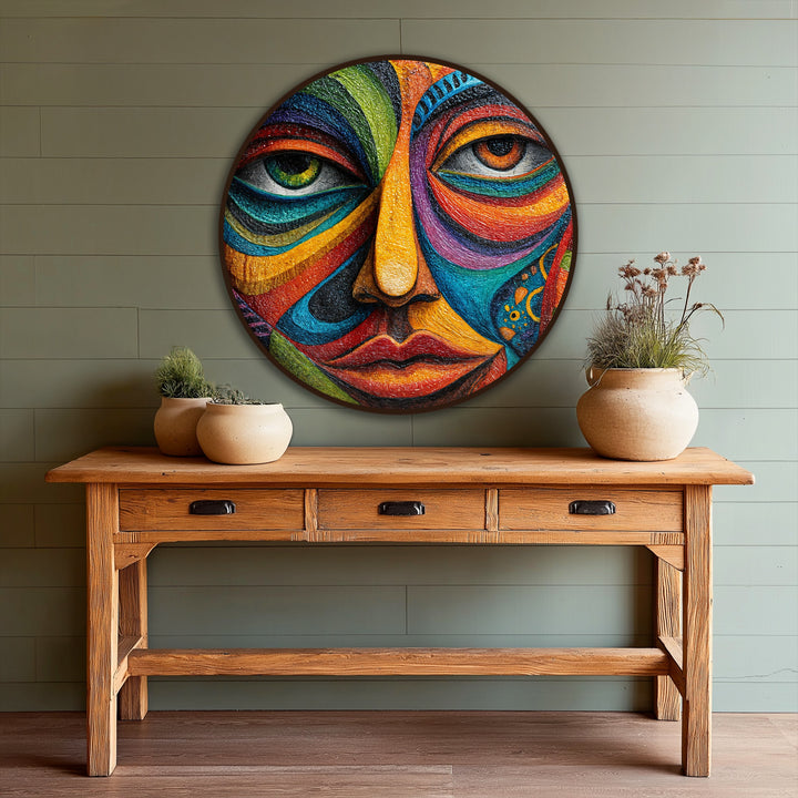 Horizontal round oil painting art piece displays a vibrant mosaic face with an expressionist design and colorful details.