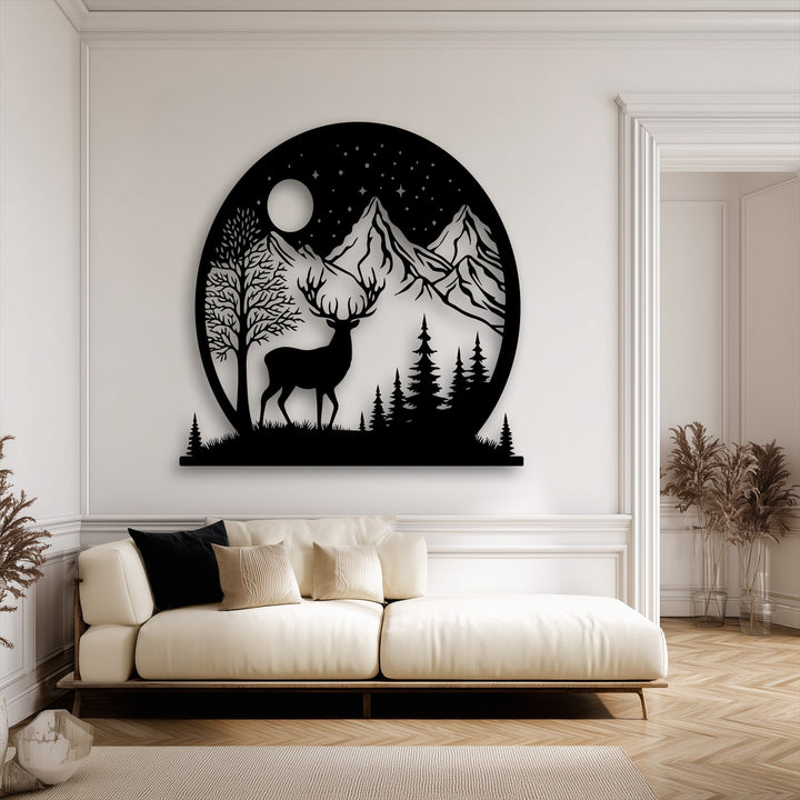 The majestic black silhouette of a deer and mountain scene, part of the decorative metal art, creates a serene moonlit wilderness focal point.