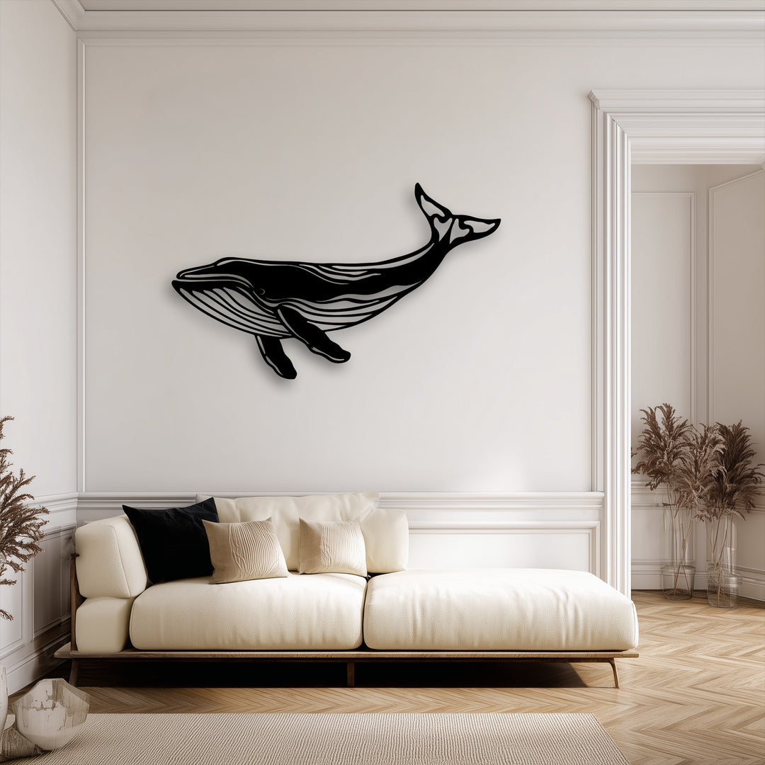 The elegant matte finish of this unique metal wall art whale silhouette casts a soft shadow, highlighting its sophisticated design.