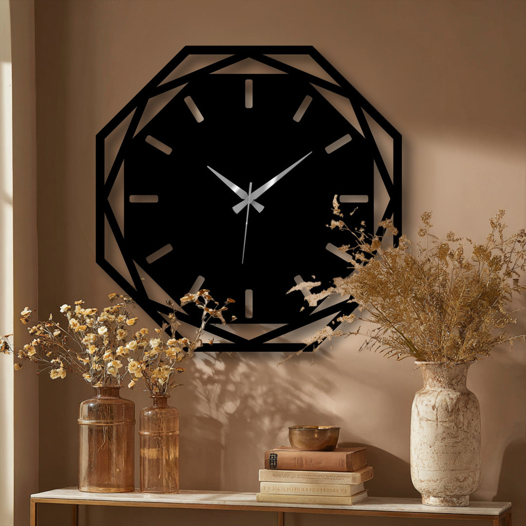 The geometric, openwork edge defines this modern octagonal metal wall clock, providing a striking frame and showcasing the artful metal wall decor against the wall.