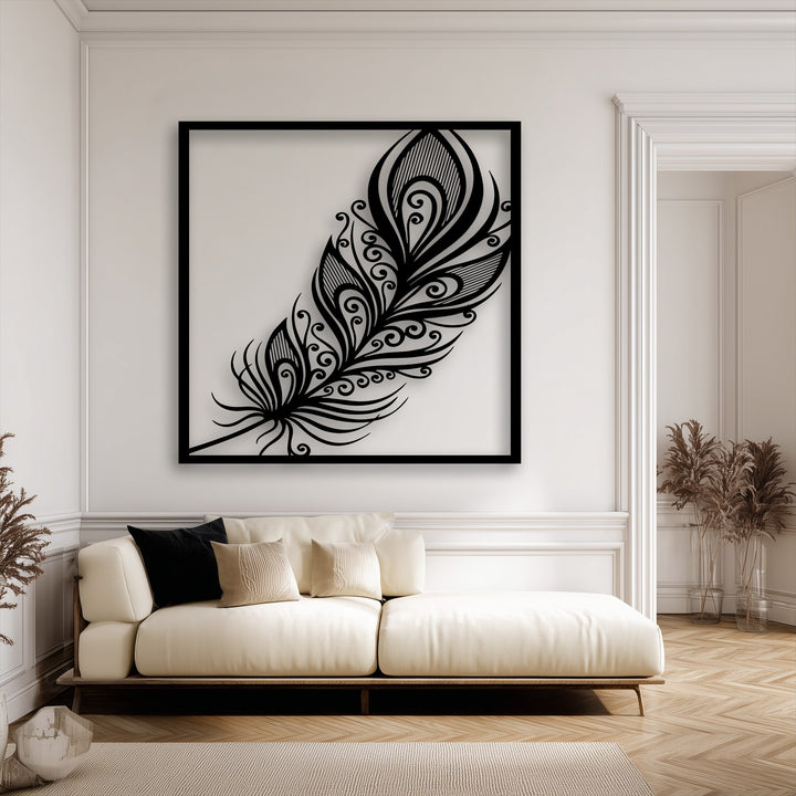 Creamy white room showcasing an elegant black ornate feather metal wall decor with swirl plume details over a light sofa.