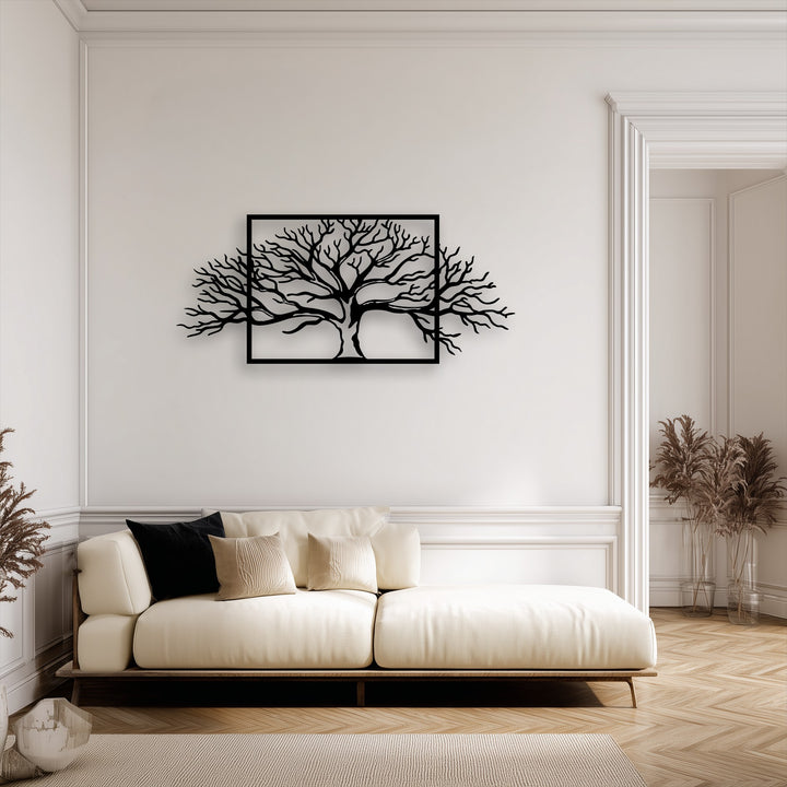Creamy off-white tones highlight a striking black framed abstract tree metal art for wall above a comfortable sofa.