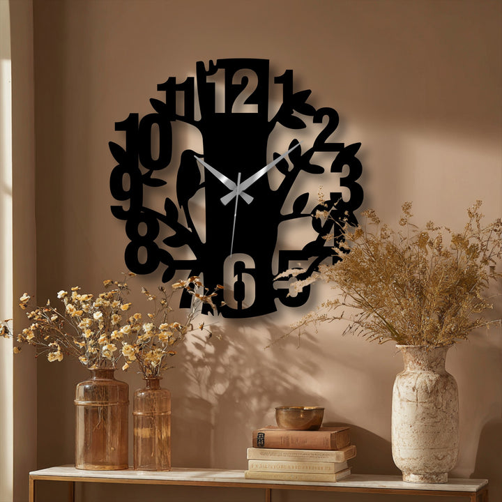 The striking abstract quality of the nature tree design modern metal wall clock enhances any room as unique decorative metal art that features bold numbers.