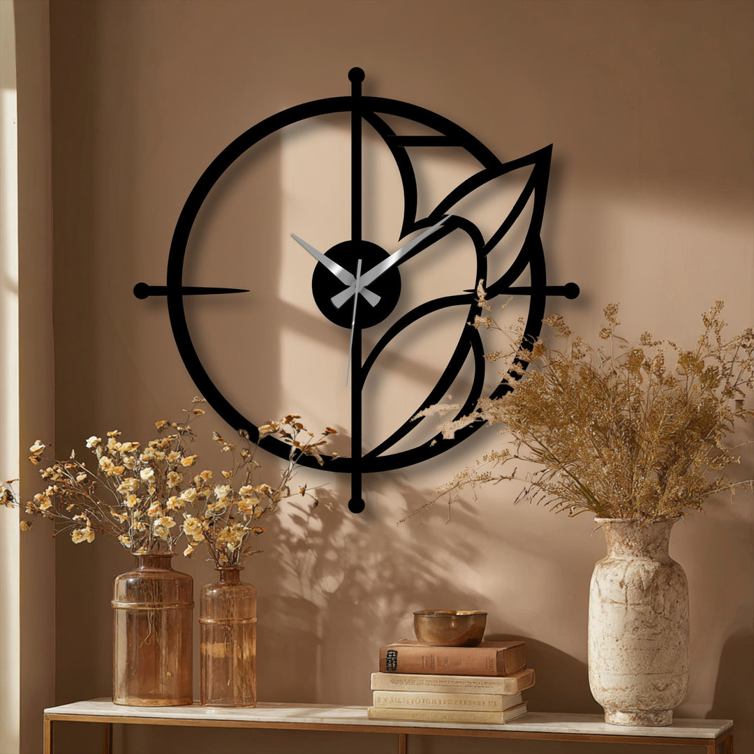 The metal wall clock's design presents a visually striking transition between the wall's neutral color and the black finish, serving as unique metal wall art.