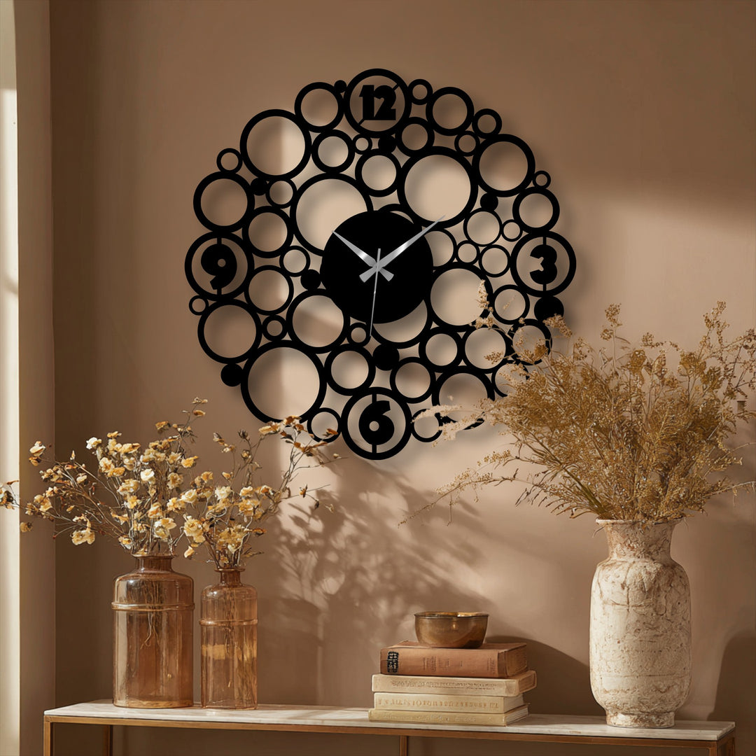 Showcasing the realistic detail, the bubble circle metal wall clock presents a unique metal wall art design with precise cutouts and an abstract pattern.