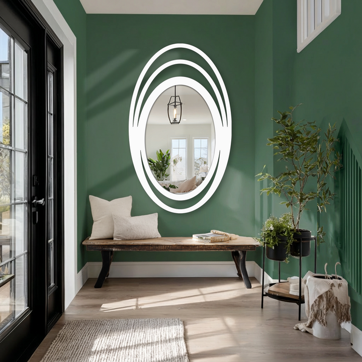 Highlighting the brightest area, this triple halo oval wall mirror reflects natural light, acting as a unique bathroom mirror and a minimalist statement piece.