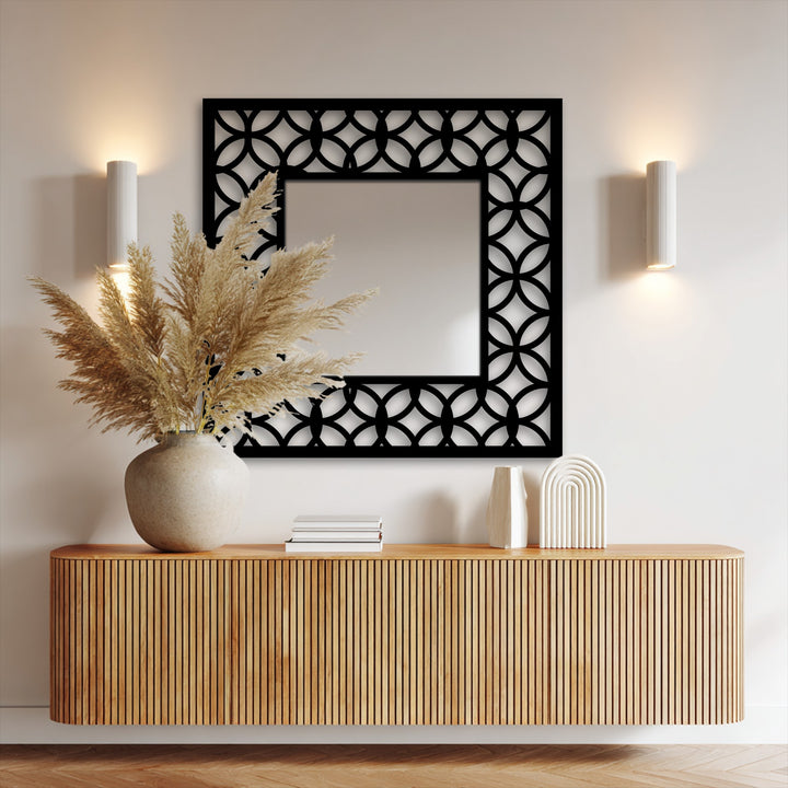 Square orientation displaying a geometric decorative mirror with an interlocking circle pattern and modern metal artwork frame.