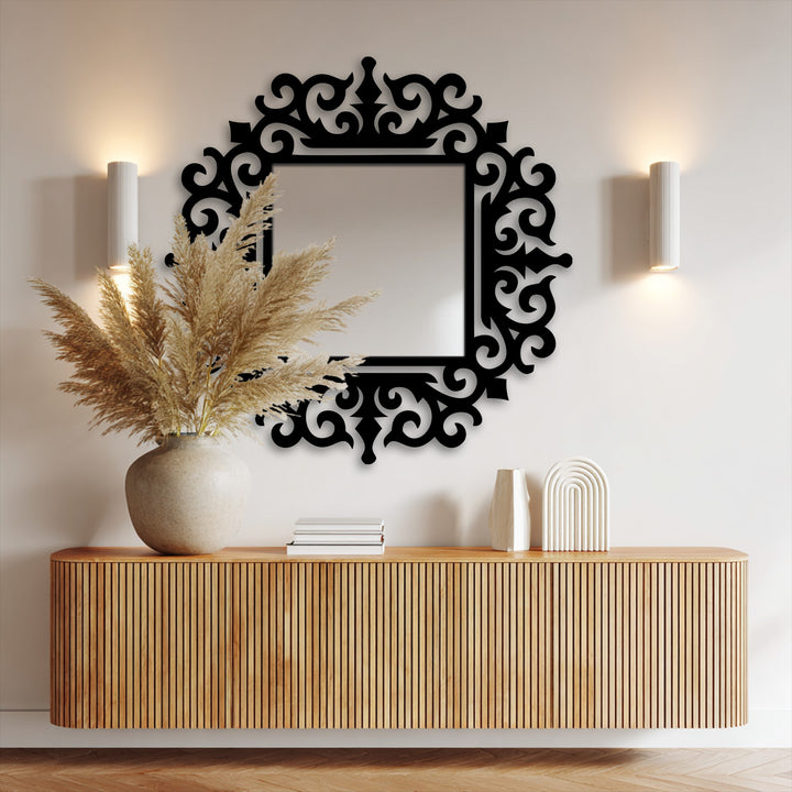 The stillness of the ornate baroque-framed square floor mirror against the wall enhances the room's decoration wall art.