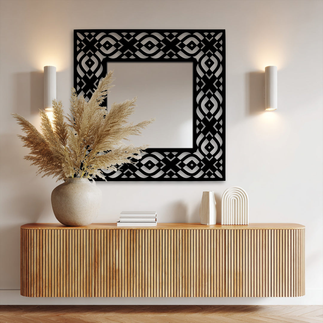 Highlighting organic forms, a symmetrical frame enhances the geometric tribal pattern on this square floor decorative mirror, a striking piece of metal art for wall.