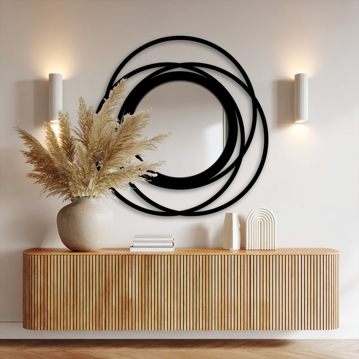 Highlighting depth and layers, the intertwined rings of this black metal floor mirror create a striking modern decorative metal art piece with a captivating dimension.
