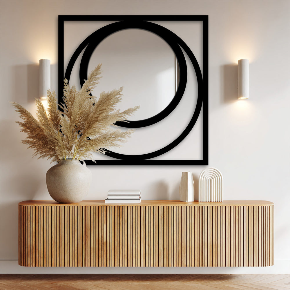 Featuring an edgy black square frame, this modern eclipse floor mirror for wall decor showcases striking borders with circular metal accents.