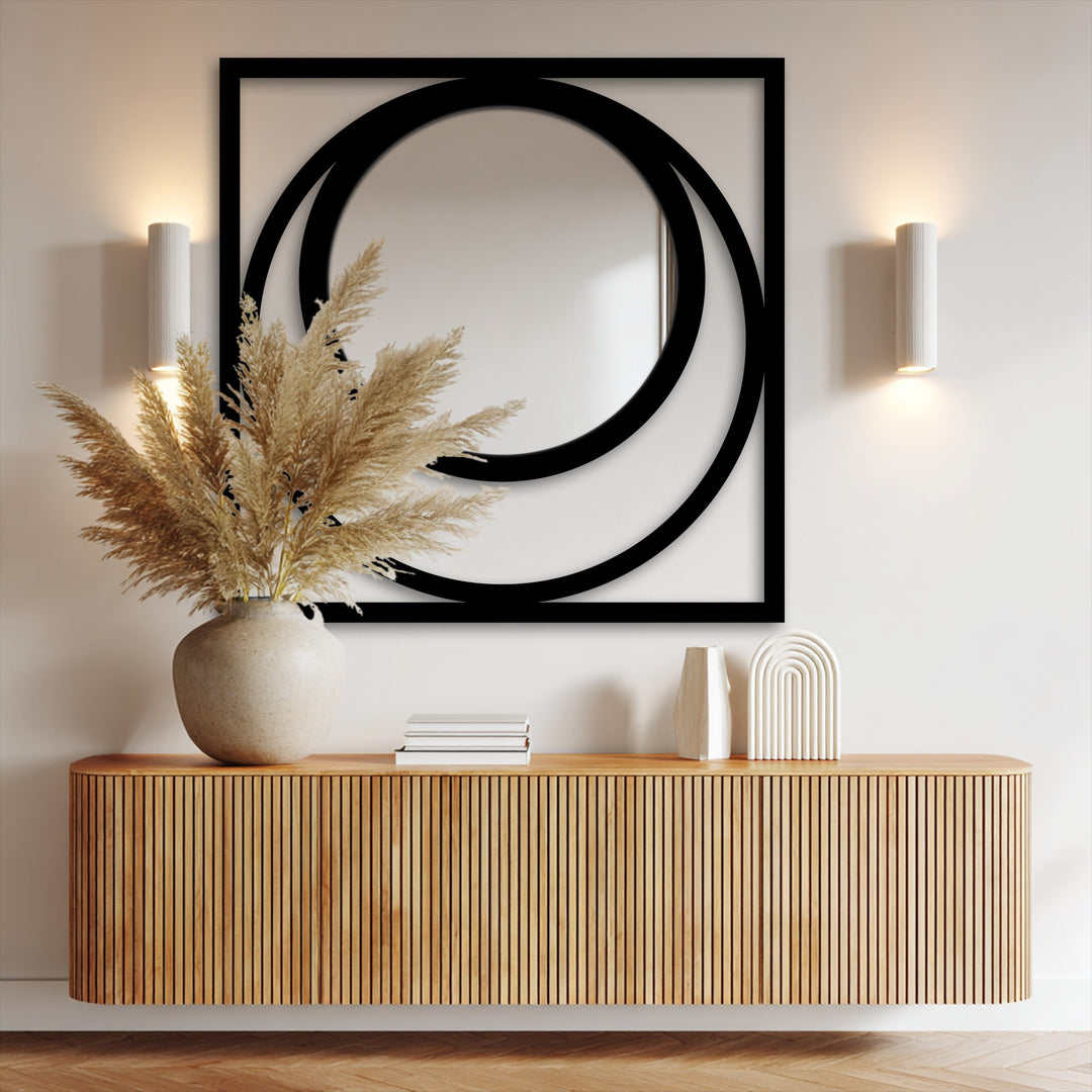 Featuring an edgy black square frame, this modern eclipse floor mirror for wall decor showcases striking borders with circular metal accents.