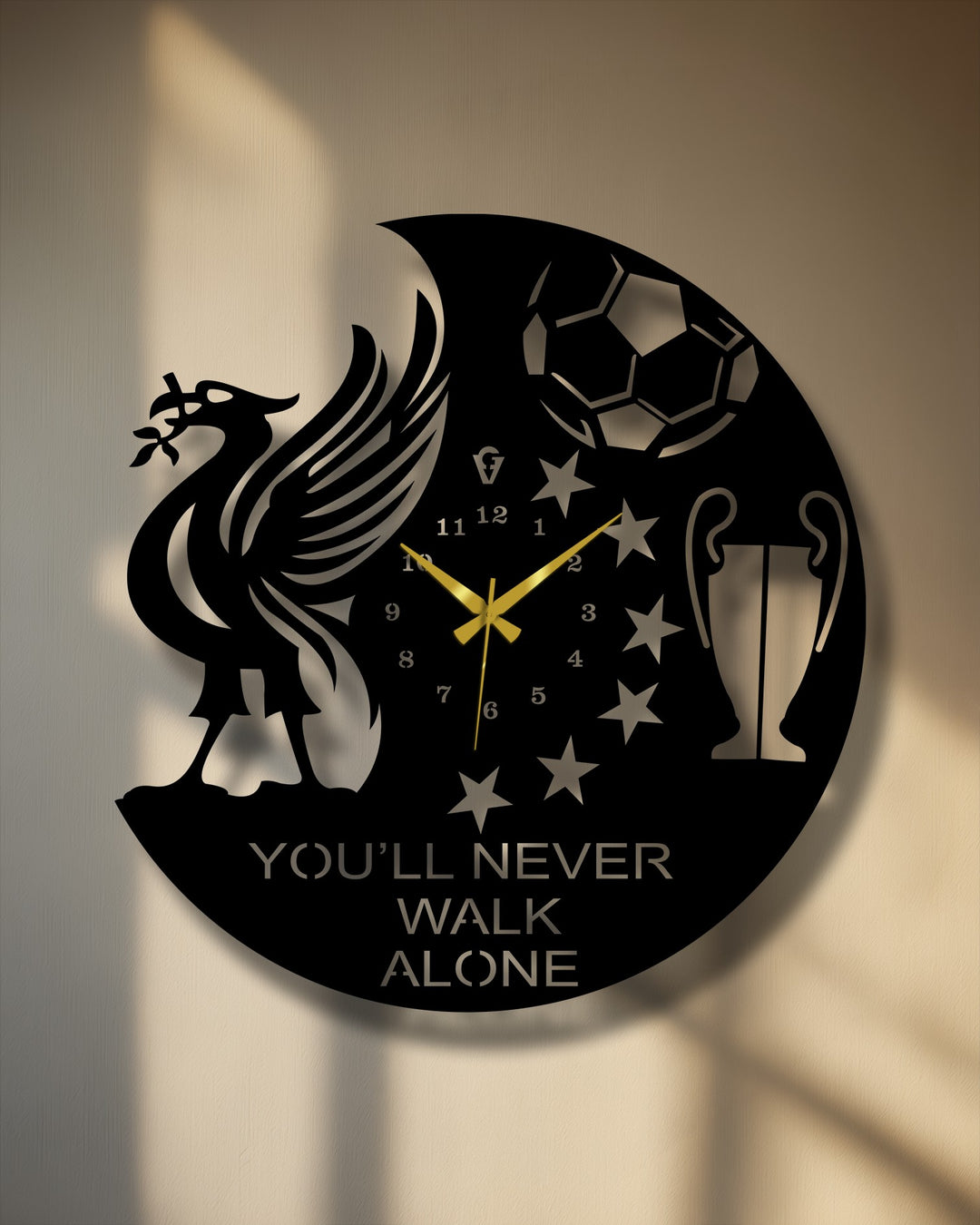 Circular decoration wall art metal wall clock, oriented vertically, features a football fan design showcasing a liver bird, football, trophy, stars, and the text 'You'll Never Walk Alone'.