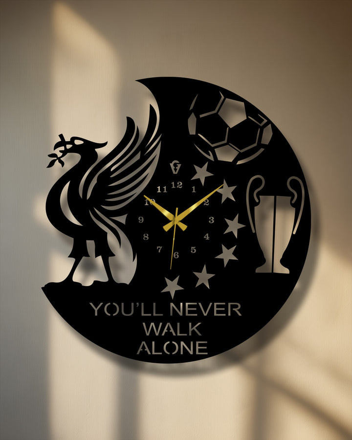 Circular decoration wall art metal wall clock, oriented vertically, features a football fan design showcasing a liver bird, football, trophy, stars, and the text 'You'll Never Walk Alone'.