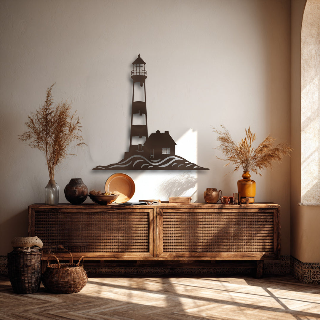 Subtle wall texture contrasts with the sleek, dark finish of the elegant decorative metal art, featuring a coastal lighthouse and house atop ocean waves.