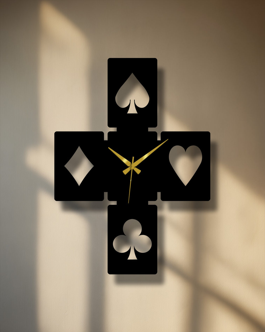Muted color saturation emphasizes the elegant black playing card symbols metal wall decor with gold hands, casting deep shadows.