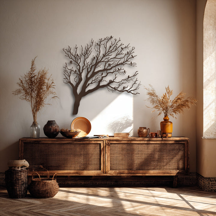 The visual rhythm of birds resting on the intricate bare branches of the nature silhouette decorative metal art flows across the wall.