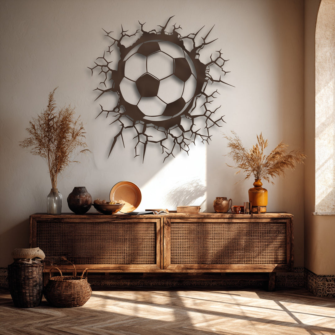 An energetic, inviting mood emanates from the dynamic breaking wall soccer ball unique metal wall art, nestled within warm, rustic decor.