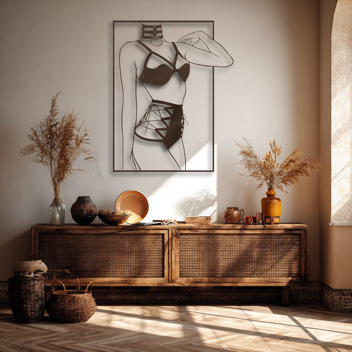 The realistic detail of this decorative metal art features a minimalist female silhouette in modern line art, enhancing a warm room.