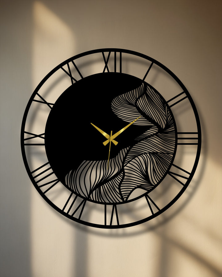 Negative space highlights the leaf design of this metal wall clock, creating a unique modern wall decor piece featuring abstract botanical elements and Roman numerals.