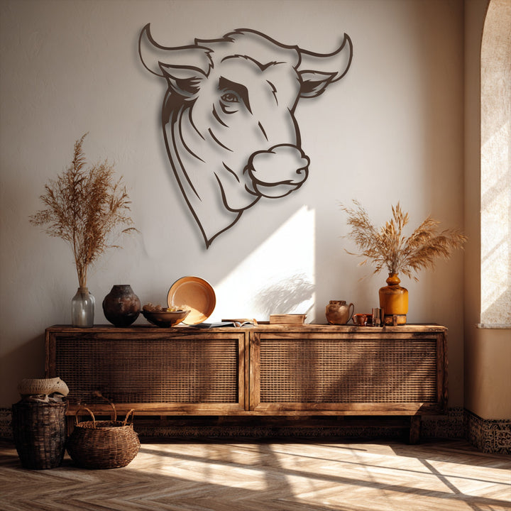 The geometric elements of the minimal line metal wall art showcase a stylized bull head outline, forming a striking piece of decorative metal art.