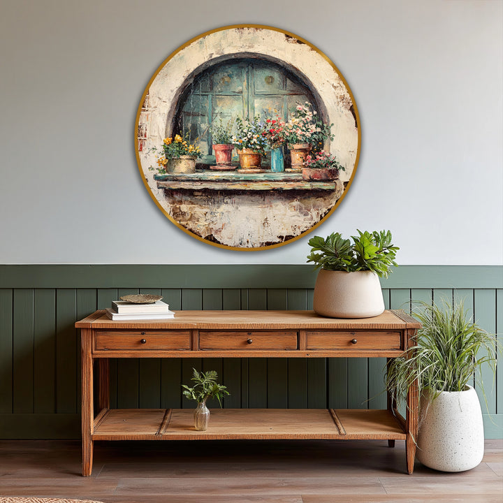 The stillness captured in this rustic window with flower pots round oil painting art piece showcases potted blooms bathed in soft light, offering a peaceful scene.