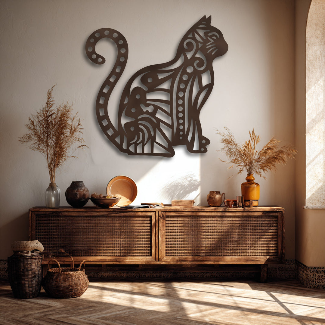 The dark brown, textured metallic finish of this decorative patterned cat silhouette metal artwork highlights its ornate design.