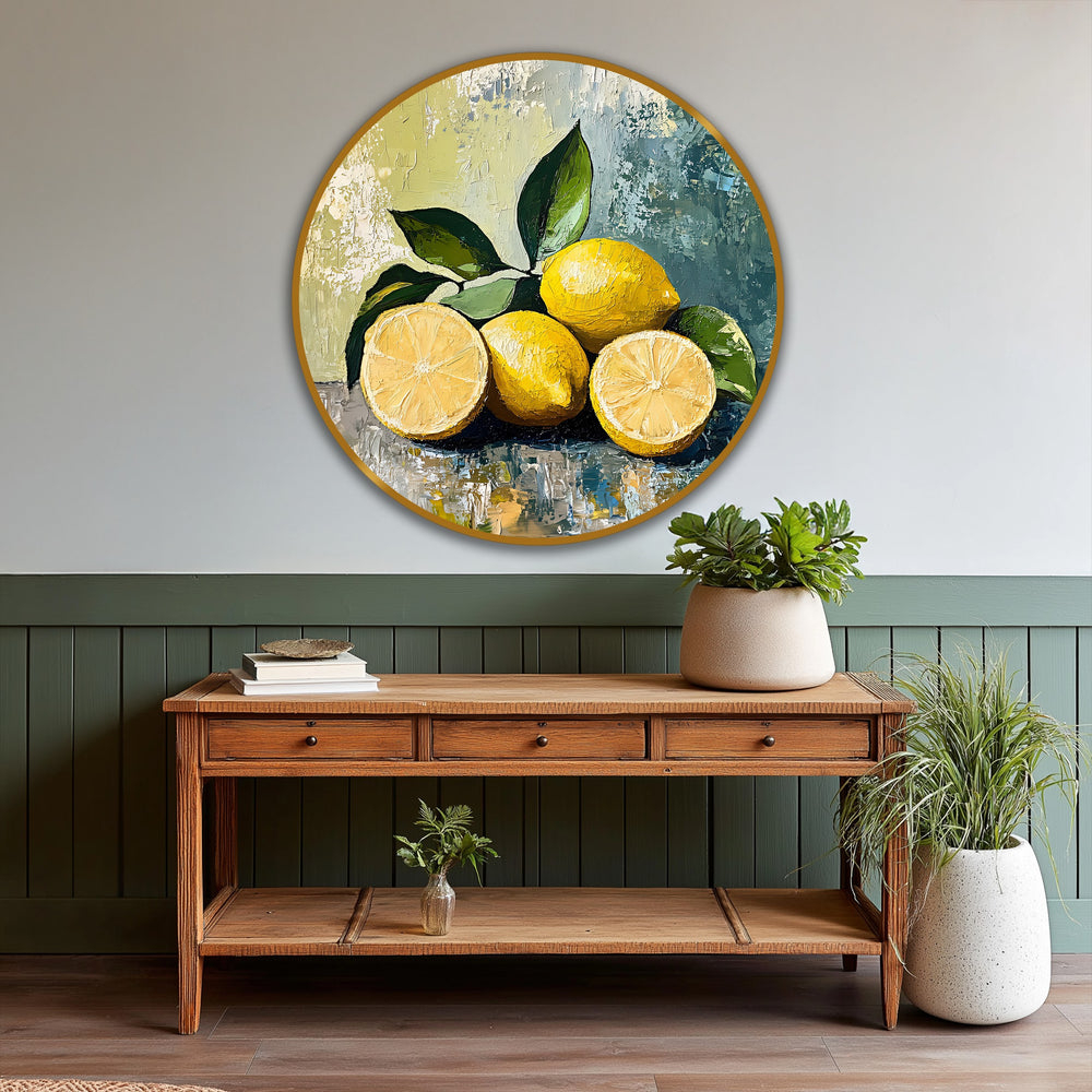 Aged wood console table displays three drawers and supports a striking round still life featuring a lemon sunlit citrus oil painting wall art.
