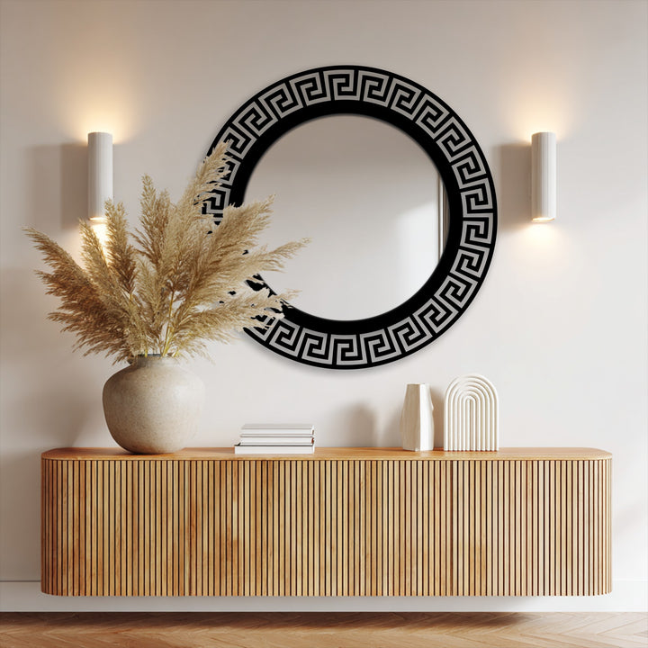 Focal point of the geometric Greek key round floor mirror showing the black frame statement design as stunning metal artwork.