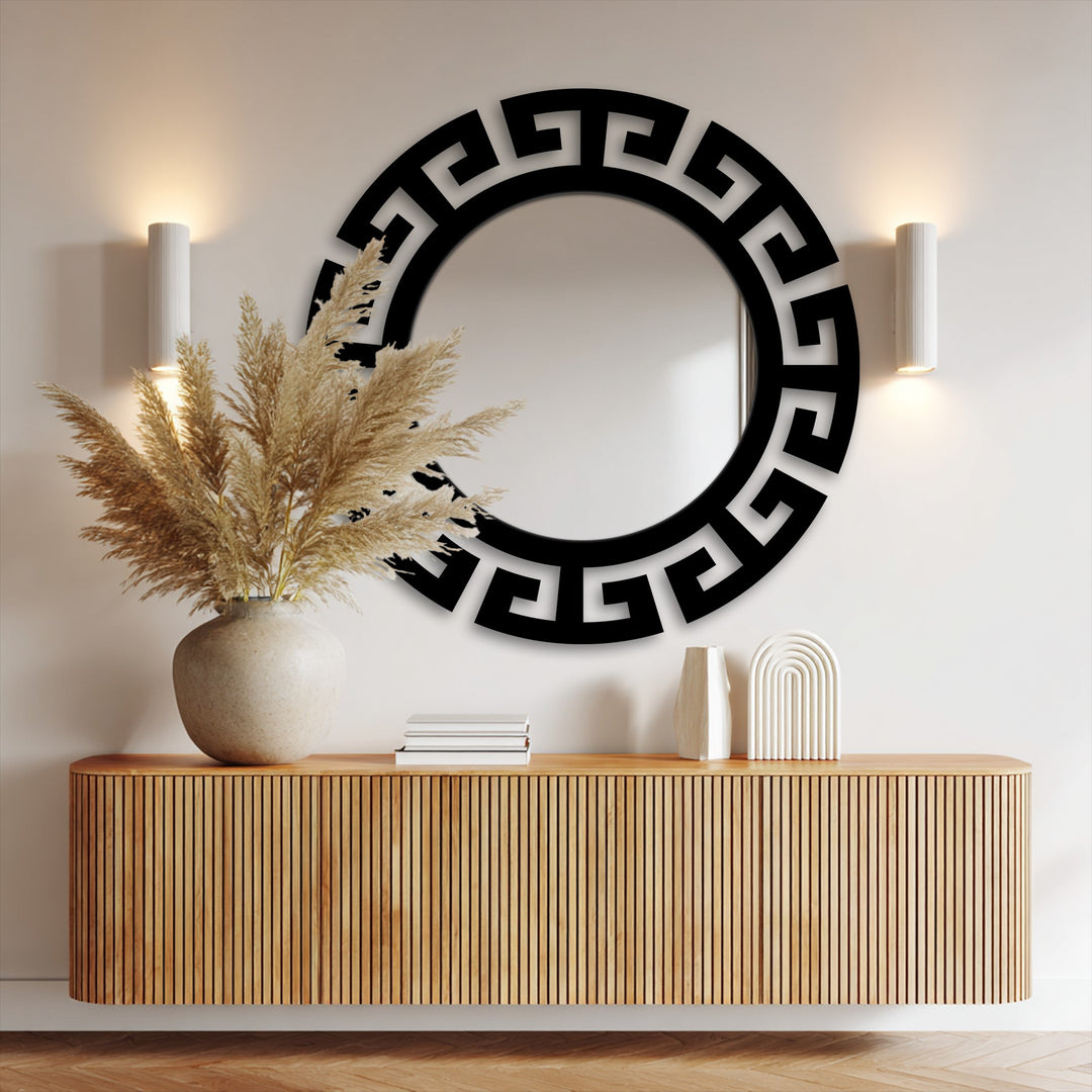 The organic forms of fluffy pampas grass beautifully complement the stylish segmented Greek key mirror for wall decor.