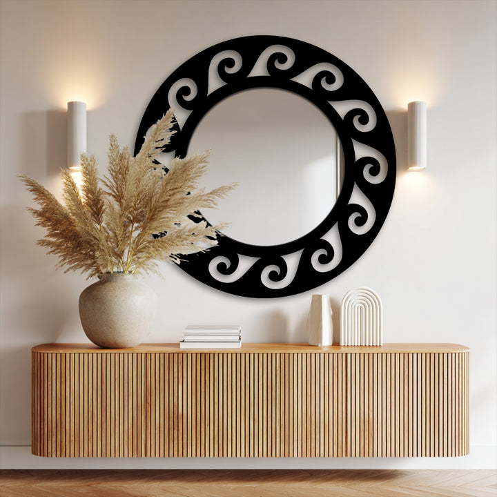 The stillness of an ornate scroll round black metal frame mirror offers elegant decoration wall art, reflecting a tranquil scene.