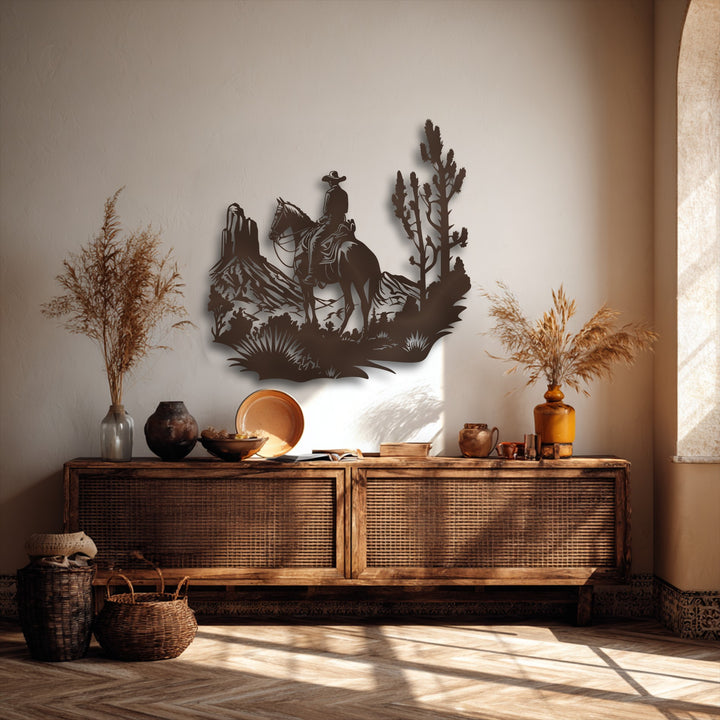 The substantial negative space around the detailed Western cowboy and desert horse rider metal wall decor emphasizes its intricate silhouette.