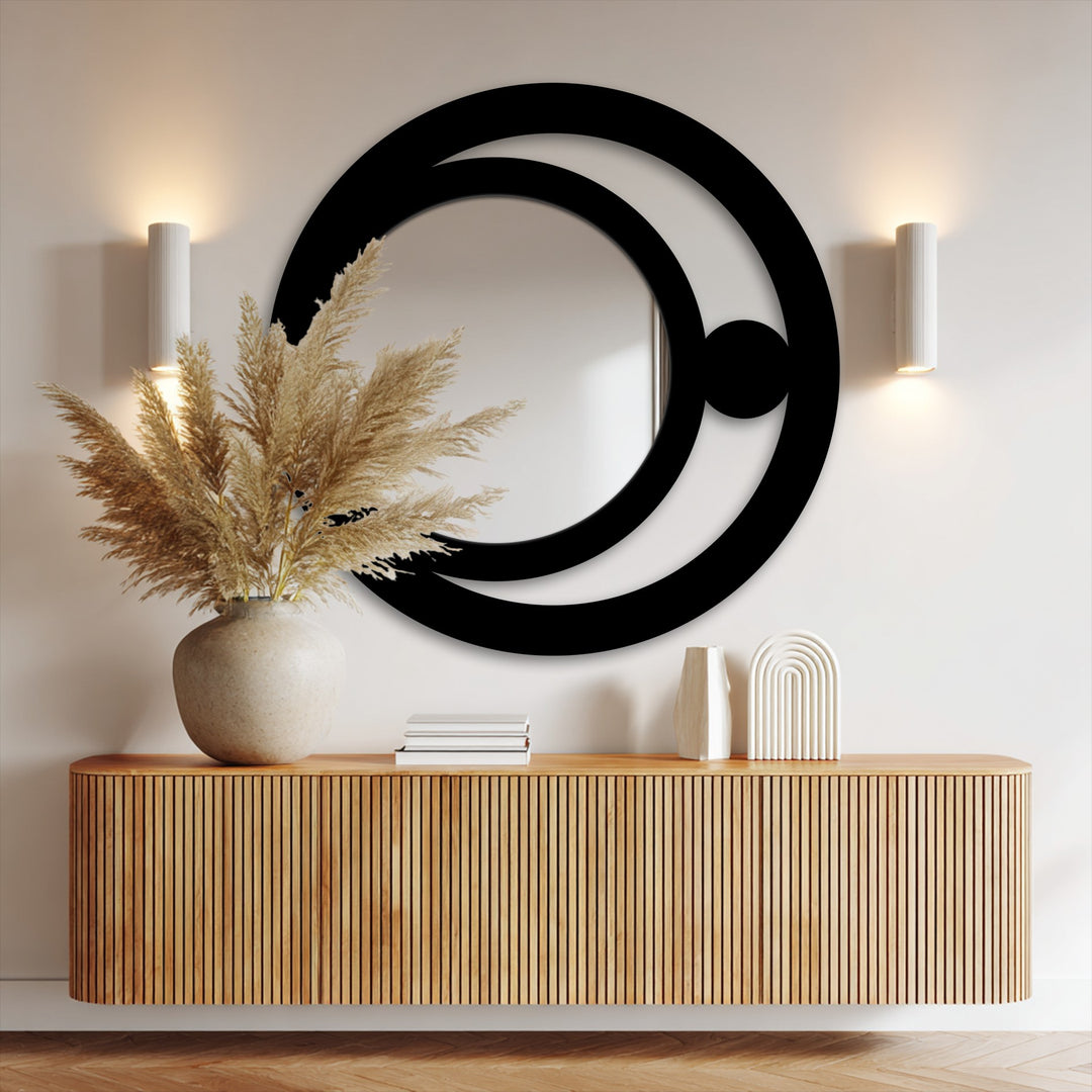 Reflecting a minimalist mood, the modern mirror showcases a crescent orb metal frame in a celestial design.