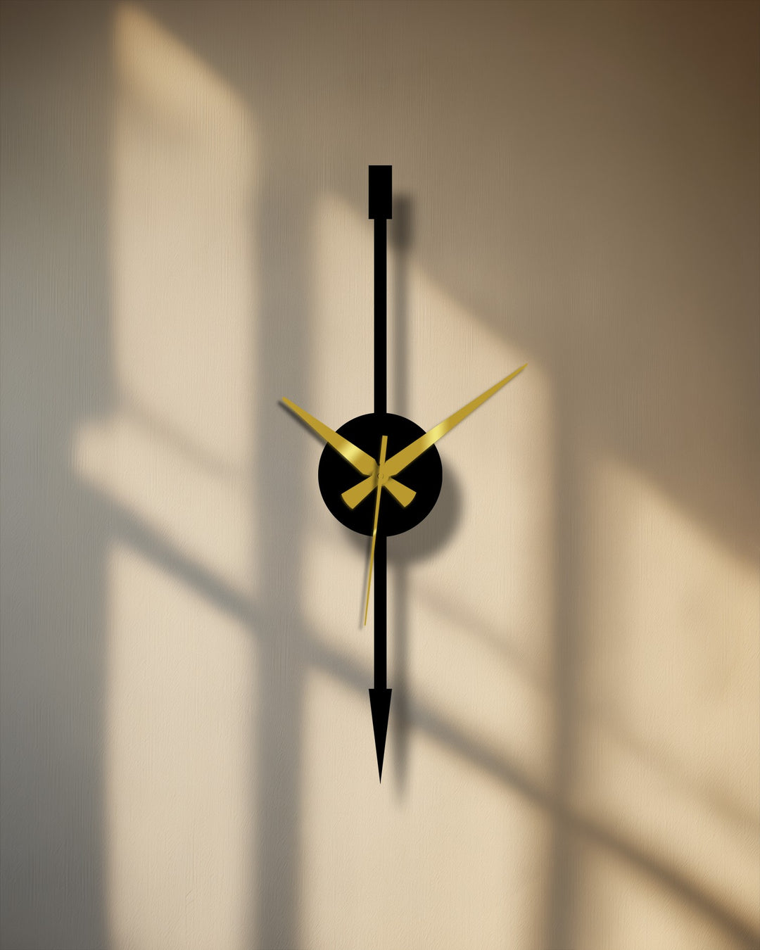 Negative space highlights the sleek design of this minimalist vertical arrow modern metal art for wall clock with striking gold hands.
