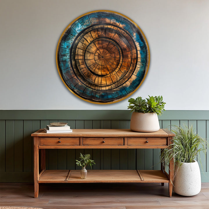 Stillness permeates the copper spiral abstract round oil painting home decor, mounted above a wooden console table with verdant plants.