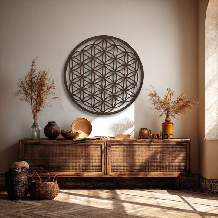 Delicate pampas grass provides a soft accent to the bold Flower of Life decorative metal art, showcasing serene sacred geometry.