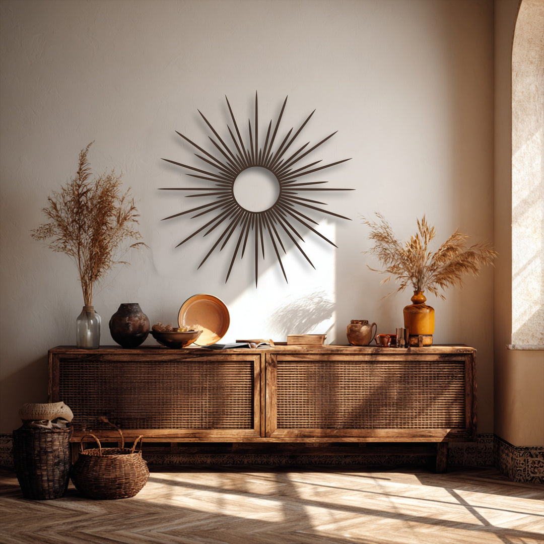 The realistic detail of the sunburst metal wall decor shines, its dark, pointed rays casting sharp, natural shadows on the textured white wall.