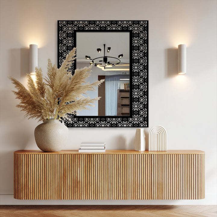 Featuring a precisely crafted ornamental frame, the bathroom mirror showcases a high-quality black metal design with a circular pattern for a sophisticated aesthetic.