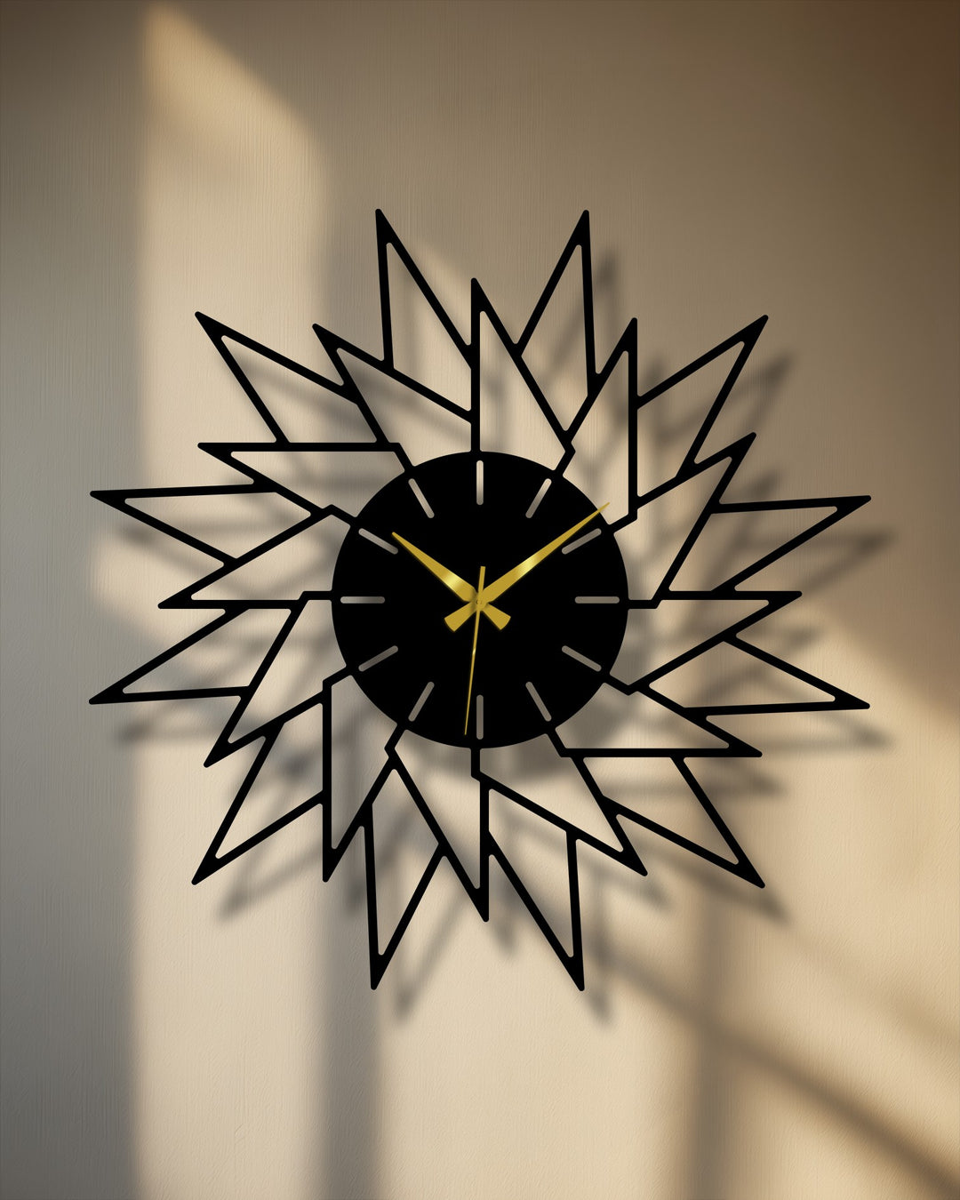 Crafted with durable material, the starburst metal wall decor features an abstract design with premium metal elements, creating a modern geometric statement piece.