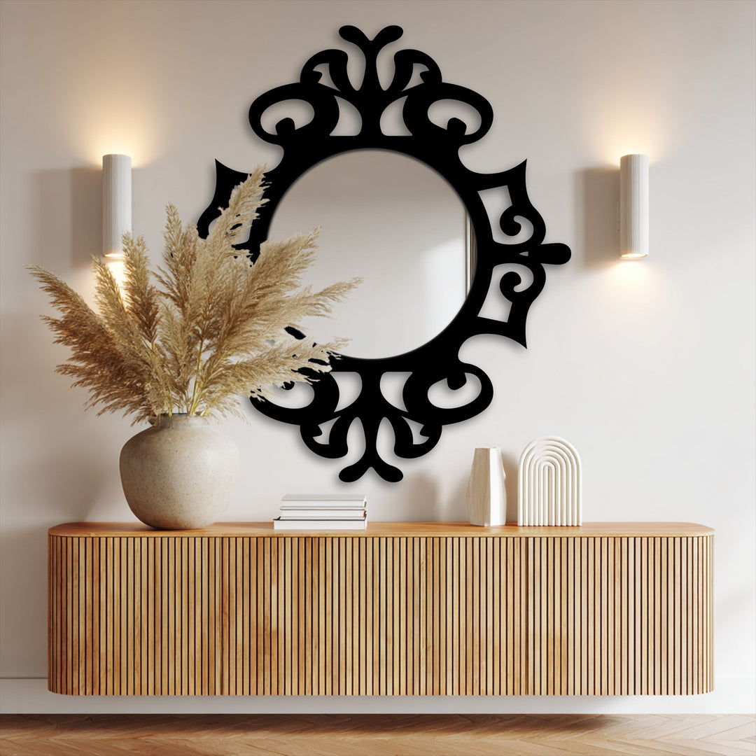 Showcasing the excellent material quality of this classic ornate black metal artwork, this round mirror reflects modern elegance with its handcrafted frame.