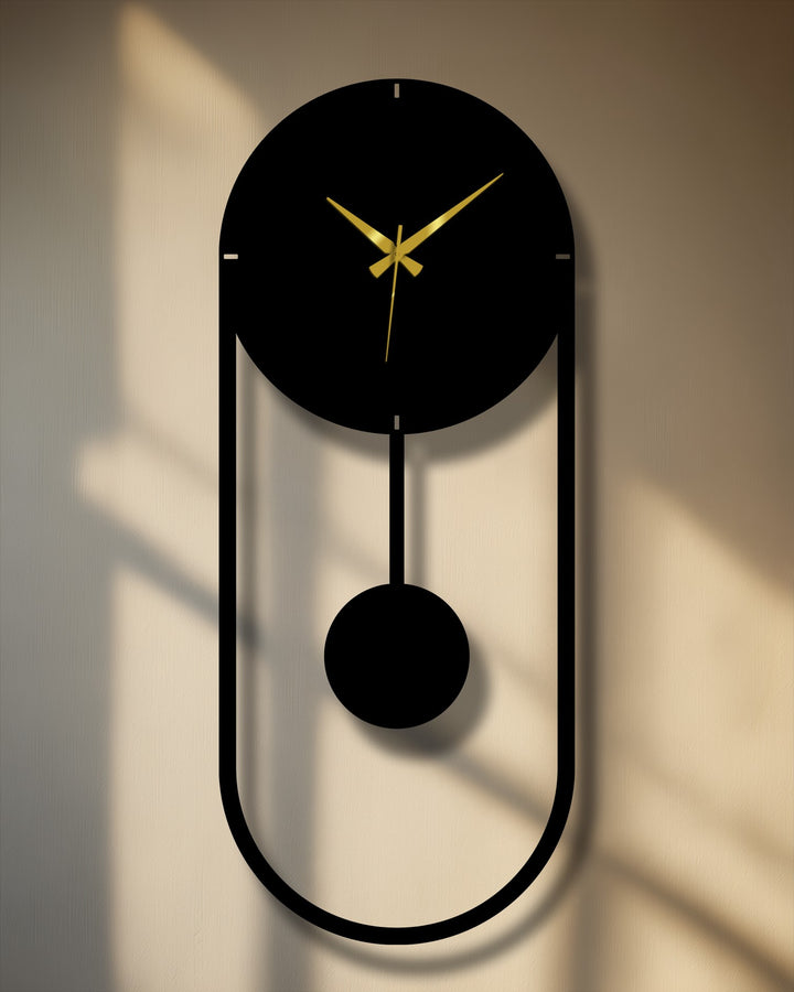 Subtle surface texture highlights the minimalist pendulum metal wall clock, showcasing a sleek and modern decoration wall art piece with its striking vertical frame.