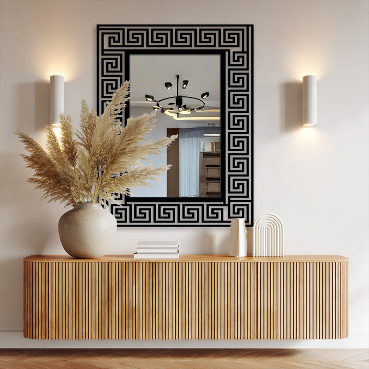 Light and shadow play across the black geometric design of the Greek Key pattern frame floor mirror, creating a dynamic visual texture within the framed wall mirror.