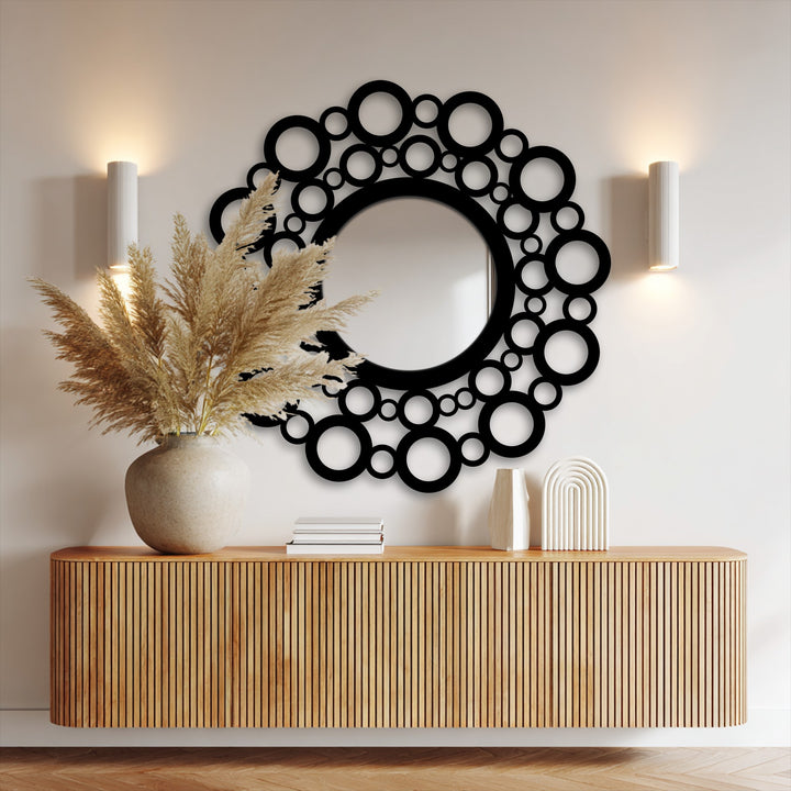 The modern artistic design of this bubble circle frame metal wall mirror offers a unique and stylish decorative mirror focal point.