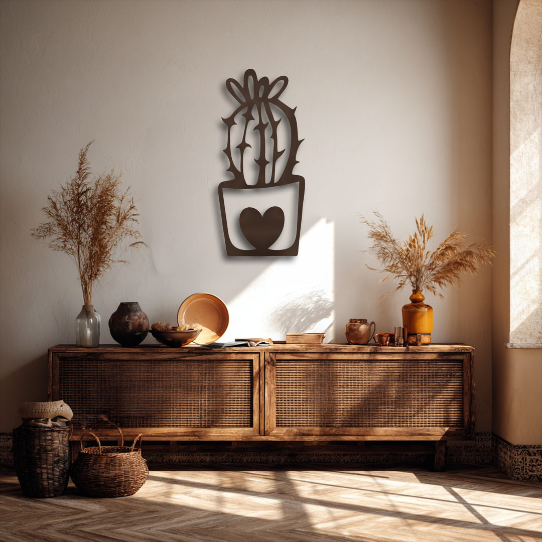 Dramatic sunlight casts intricate shadows around the cute cactus unique metal wall art, enhancing the minimalist decor.