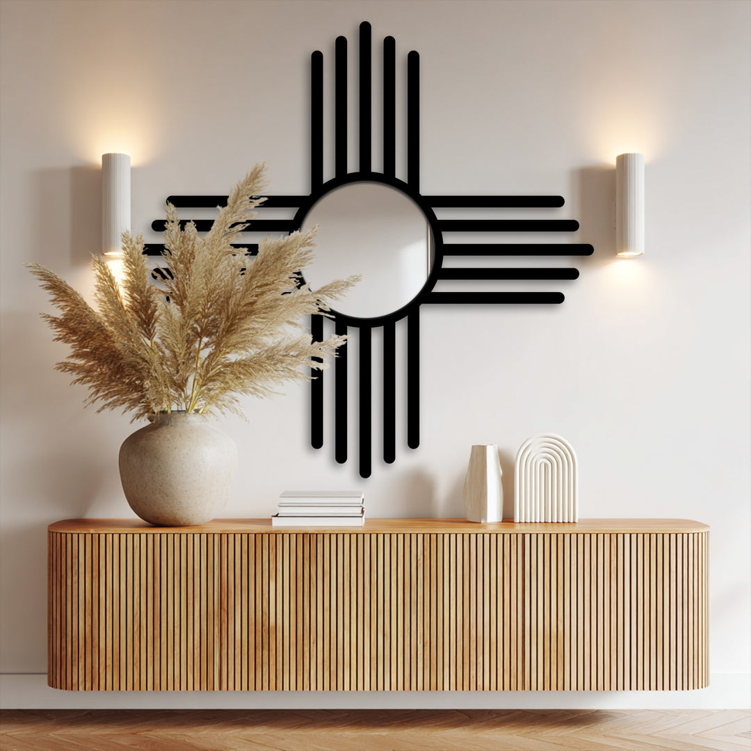 The stillness of a minimalist interior is conveyed by the unique metal wall art, a black cross-line mirror above a wooden console table.