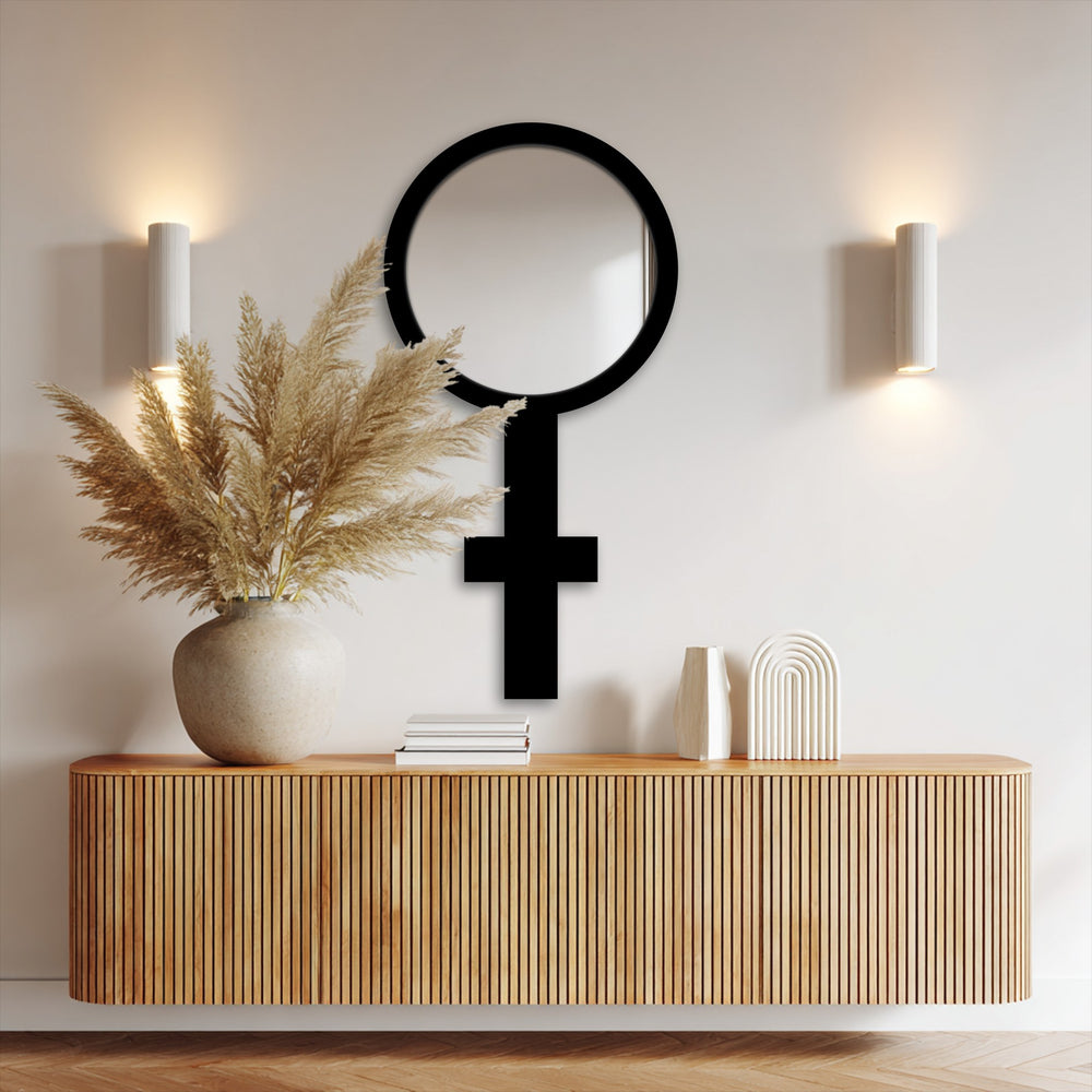 Highlighting the abstract quality, this symbolic floor mirror with a stark black frame offers a unique piece of metal wall decor to elevate modern interiors.