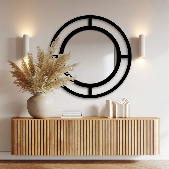 The focal point of this modern double ring mirror reveals sleek lines and a black frame, reflecting stylish modern wall mirrors.