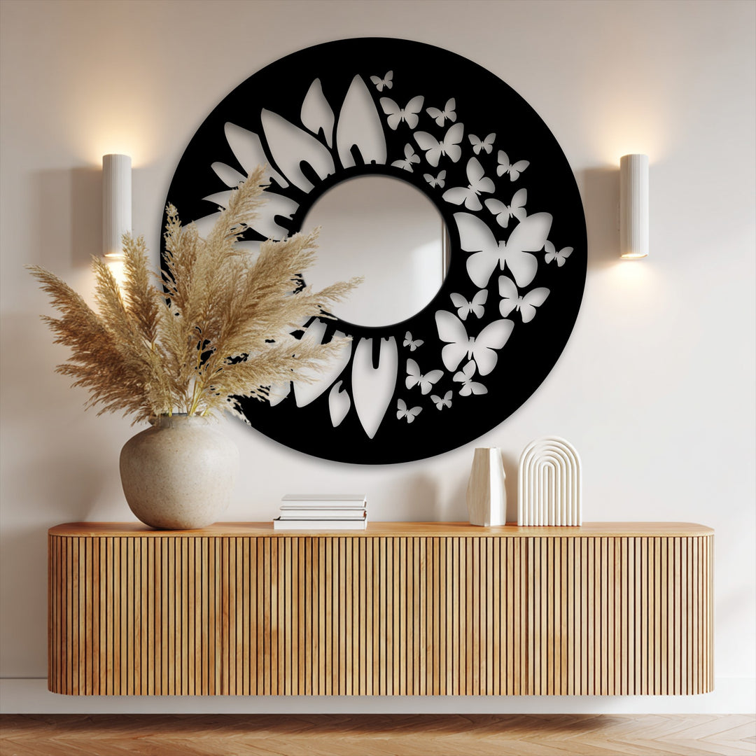 Subtle shadows accentuate the black metal frame and delicate butterfly cutouts surrounding the Butterfly Bloom bathroom mirror, highlighted by adjacent sconce lighting.