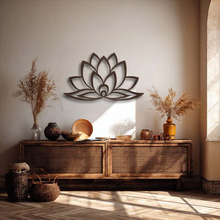 The realistic detail of this minimalist lotus bloom decorative metal art is visible, casting deep shadows on the textured wall.